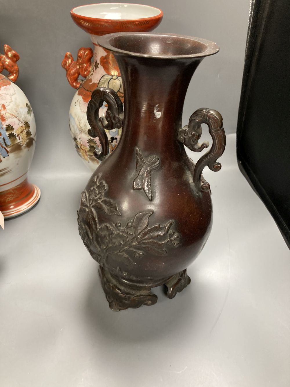 A pair of Japanese two handled bronzed vases and a pair of Japanese Kutani vases, tallest 37cm